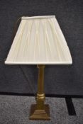 A 20th century brass lamp base in the form of a classical column.