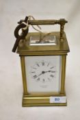 An early 20th century Elkington carriage clock having brass case with visible gallery.