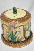 A 20th century cheese dome in a Minton Majollica style in very fine condition.
