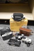 A selection of vintage cameras including Instamatic 233-x, Instamatic 25 and Agfa Isolette.