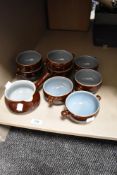 A set of six Denby soup bowls with a similar jug.