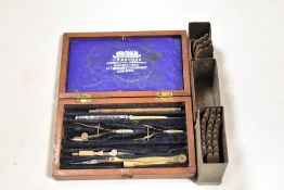 Two sets of engineers or metal workers numeral and letter stamp sets along with a W.H Harling part