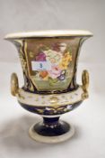 An antique campana urn bearing an early red Crown Derby style mark. Having hand painted panel of