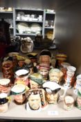 A selection of character and Toby style mugs and tankards including Royal Doulton and Crown