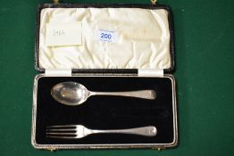 A cased HM silver spoon and fork set, missing knife.