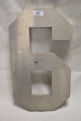 A modern folded steel number 6 or 9.