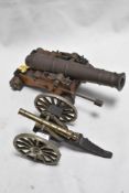 To replica model cannons including a very heavy cast brass cannon.