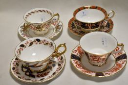 Four modern Royal Crown Derby tea cup and saucer sets including A.1297, A.1295, A.1296 and A.1299