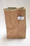 A Rosenthal bisque ceramic paper bag. 20cm tall.