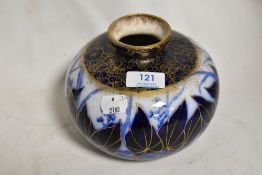 An early 20th century Imperial Porcelain Wedgwood squat form vase in blue print with overlay and