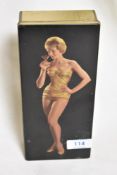 A 1950's transfer printed tin with a pin up girl image.