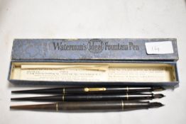 Three Waterman Ideal Desk Model lever fill fountain pens in a Waterman box. All in fair condition