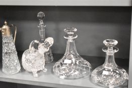 A selection of modern fine clear cut crystal glass wares including two ships style decanters, a
