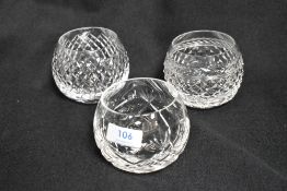 Three modern Cumbria Crystal glass ball form tumblers each with a different cut one having