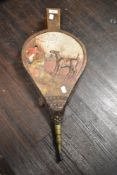A pair of realy 20th century fire side bellows having a carved and hand painted scene of a