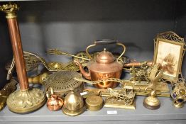 A selection of brass and copper wares including picture frame, lamp base, chestnut roaster and