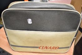 A mid century Cunard Transatlantic flight advertising bag.