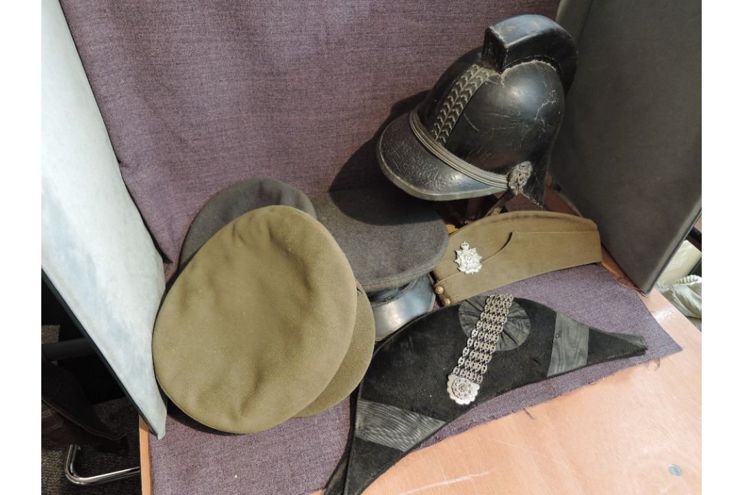 A Bicorne Hat having makers name H Poole & Co, Saddlerow having white metal decorated badge, along