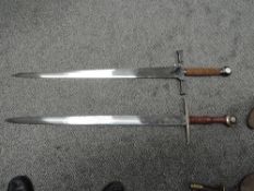 Two modern re-enactment 16th century Two Handed Broadswords, one having wooden grip and one having