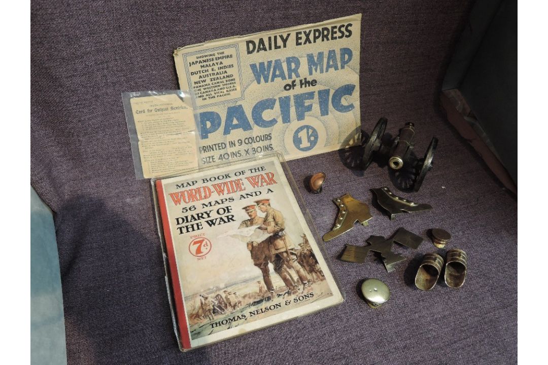 A collection of Militaria including WW2 Daily Express War Map of the Pacific, Map Book of the