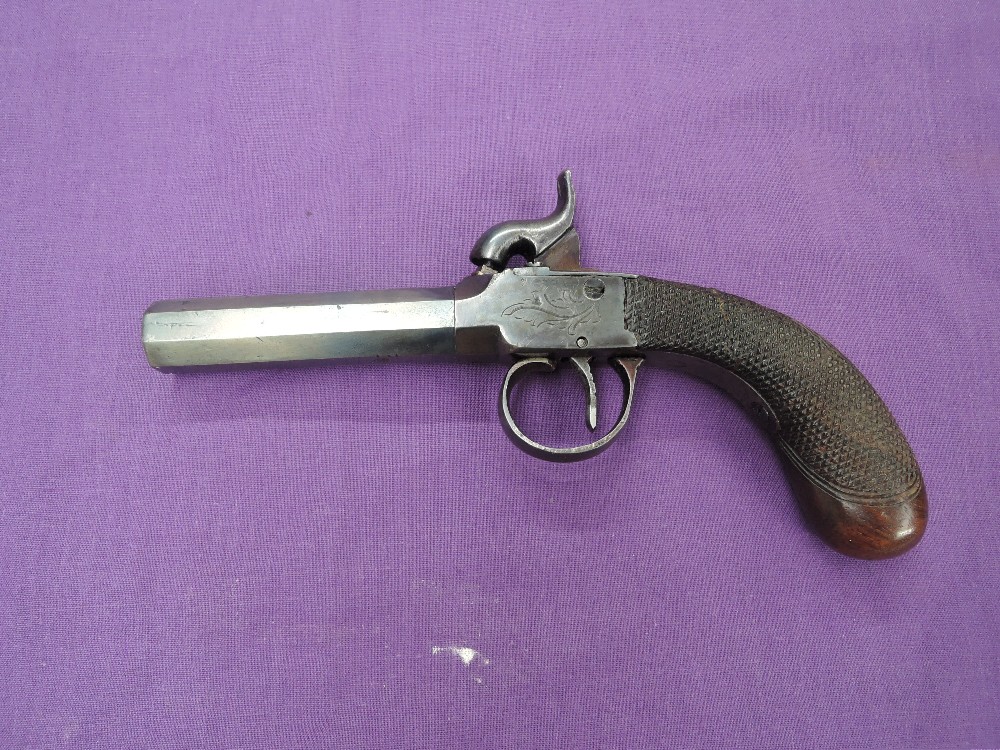 A 19th century Turn Barrel Percussion Pocket Pistol having proof marks under barrel, wooden