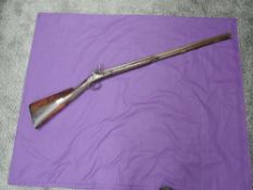 A 19th century or earlier Flintlock Musket having hexagonal and round barrel, marked on barrel in