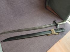 A French Sword Bayonet model of 1859 No411?C, marked 1864 on blade, with metal Scabbard marked 7