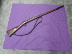 A French Chassepot MLE 1866 Rifle, uses self contained paper cartridge, leather shoulder strap, 1867