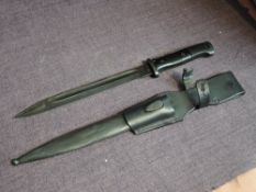 A German WW2 1937-45 black Bayonet with plastic grip, metal scabbard, leather frog No4115, 44FFC