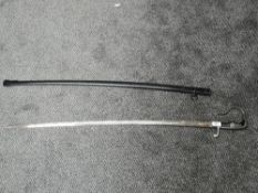 A German Officers Sword, slightly curved blade, blade marked Eickhorn, stirrup hilt, metal scabbard,
