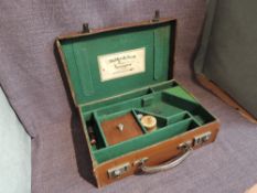 A fitted leather Pistol Case without Pistol containing Gun Accessories, Deactivated Bullets and