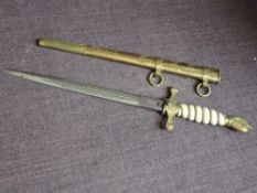 A German Third Reich Kriegsmarine Naval Officer's dagger with metal scabbard, blade engraved with