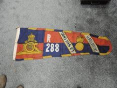 A vintage Royal Artillery Standard, R288 in blue, red and gold, some holes seen, depicting the Royal