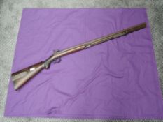 A 19th century or earlier Percussion Rifle having hexagonal barrel, metal decorated compartment to