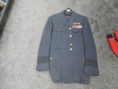 A RAF Group Captains Jacket & Trousers, all buttons present, RAF cloth badge with three rows of