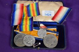 Four collectable souvenir coins/ medals, including 1981 Charles and Diana, 1977 Elizabeth and