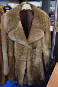 A vintage fur coat, medium to large size.
