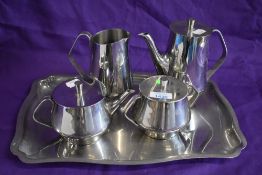 A Mid Century Orfinox polished steel tea set with tray.