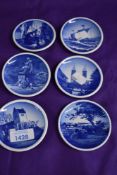 Six miniature Royal Copenhagen plates, having scenes of boast, buildings and statues etc.