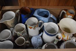 A collection of fourteen jugs some AF including makers such as Heron Cross Pottery, Portmeirion