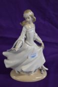 A Lladro figure study Cinderella AF having lost a finger and thumb.