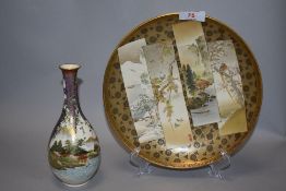 Two pieces of early 20th century Japanese Satsuma ware including a bottle form vase and plate