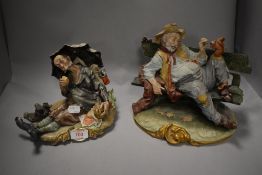 Two Capodimonte figure studies of lazy tramps, one in gloss and one in bisque. Both having minor