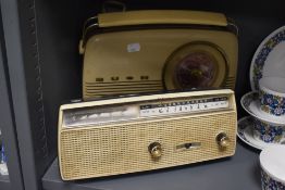 A mid century Bush radio and a Sanyo 6 transistor cordless radio.