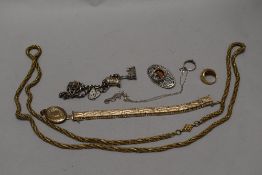 Costume jewellery including a HM silver charm bracelet and yellow metal necklace, ring and bangle.