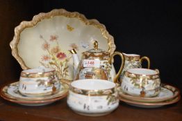 A Japanese Satsuma breakfast set, comprising sugar basin, creamer, two cups, two saucers, two side