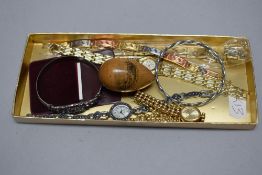 A selection of modern ladies wristwatches with a bangle and Mauchline egg.