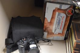 A modern Fuji film Finepix S digital camera with box and case.