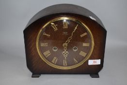 An early 20th century Smiths oak cased mantel clock.