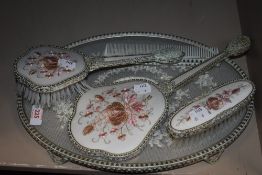 A vintage dressing table set with lace work design.